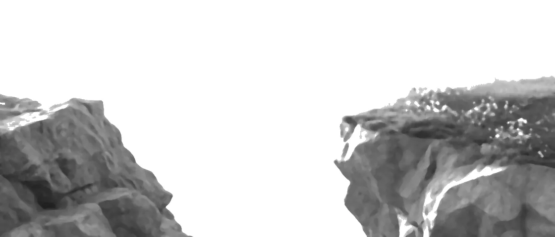 Two cliff edges facing each other across open sky.
